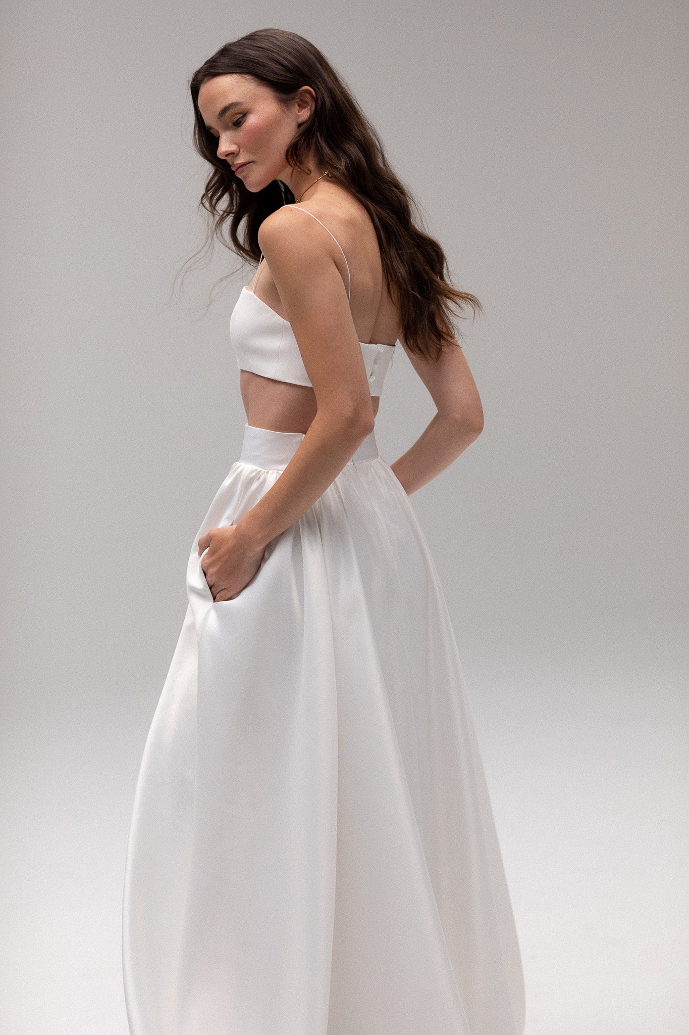 Detailed view of a high-waisted satin gathered maxi skirt by TEMPÊTE, offering an elegant and modern fit, perfect for creating a stunning wedding day outfit