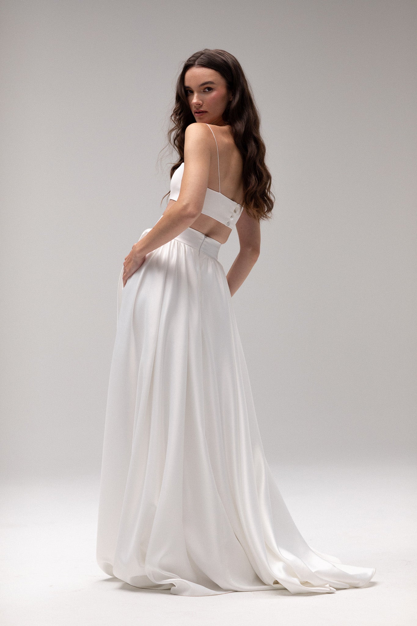 Detailed view of a high-waisted satin gathered maxi skirt by TEMPÊTE, offering an elegant and modern fit, perfect for creating a stunning wedding day outfit