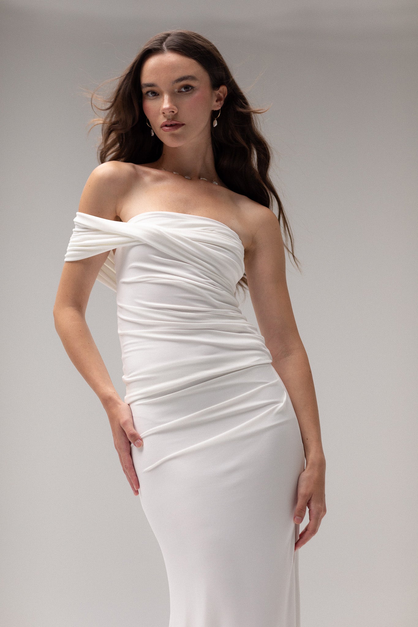 Bride in a draped one-shoulder knit top from TEMPÊTE, showcasing a stylish and elegant design that pairs beautifully with any bridal skirt or pants