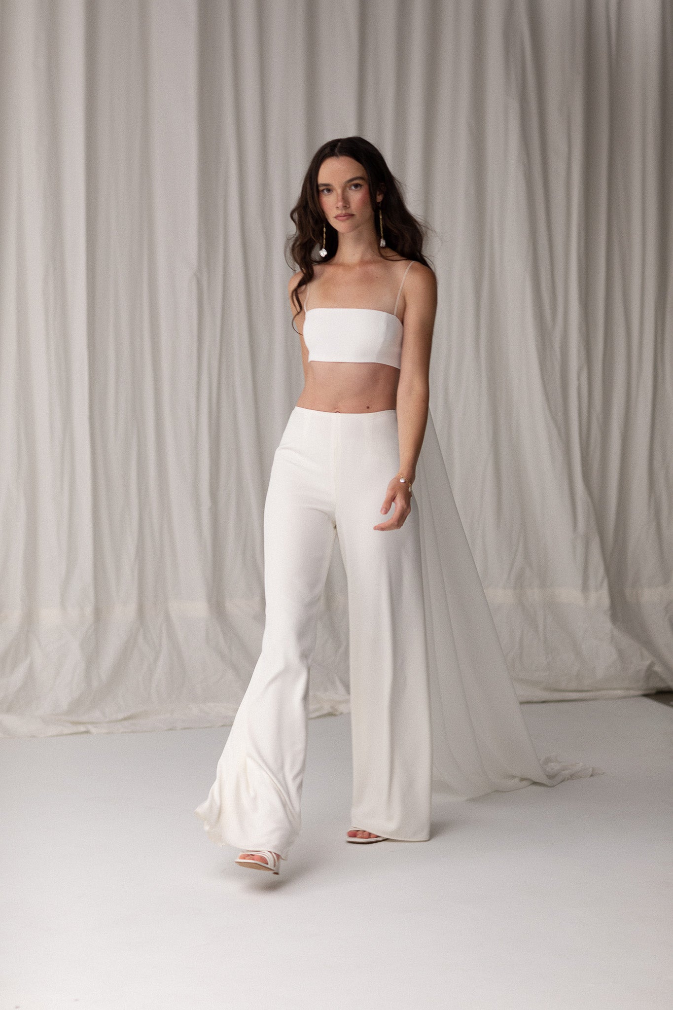 Close-up of wide-leg high-rise pants, offering a flattering and versatile design, perfect for creating a modern wedding outfit by TEMPÊTE