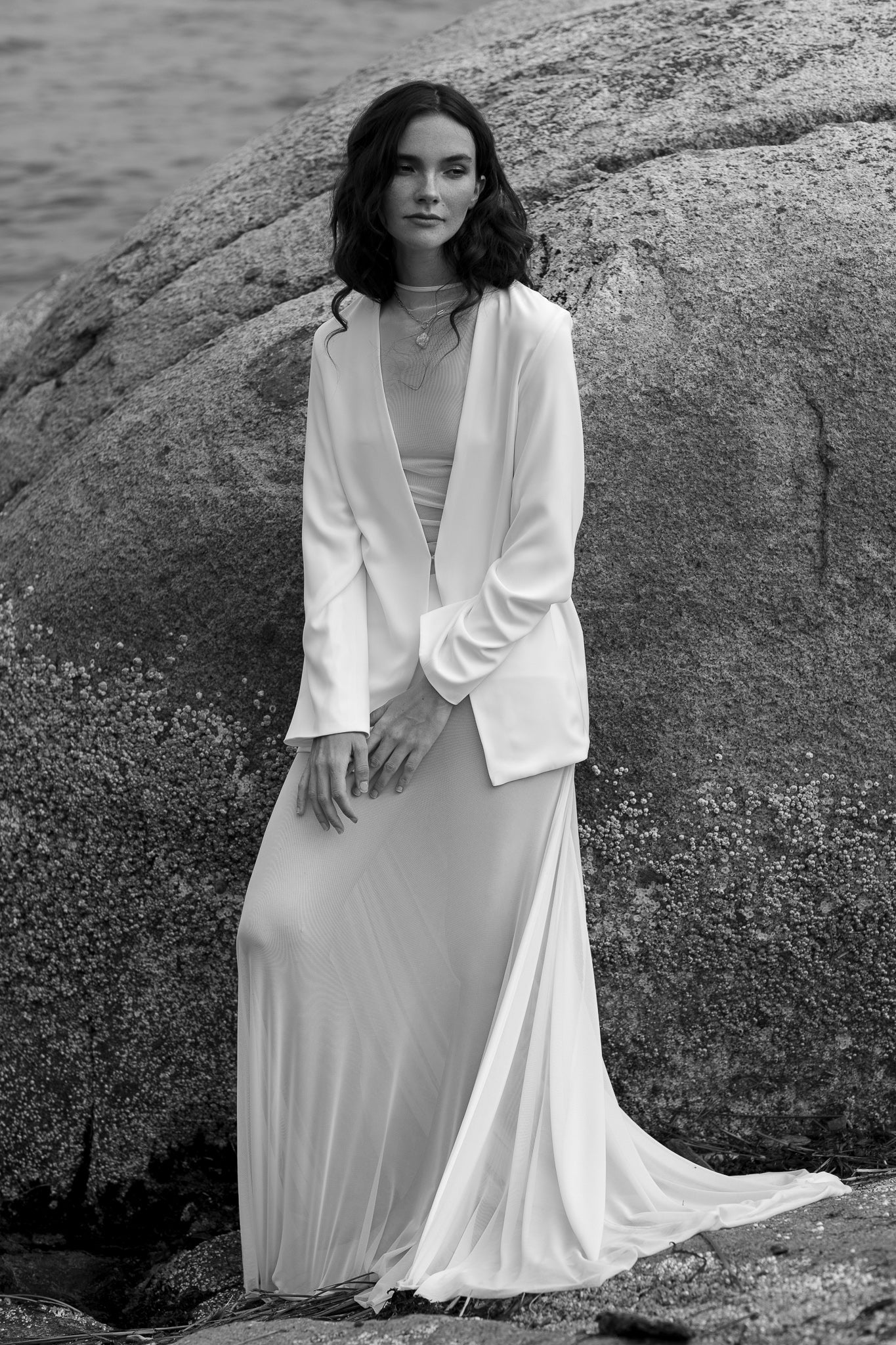 Bride in TEMPÊTE’s oversized crepe blazer, showcasing a cool, contemporary design perfect for layering over wedding outfits.