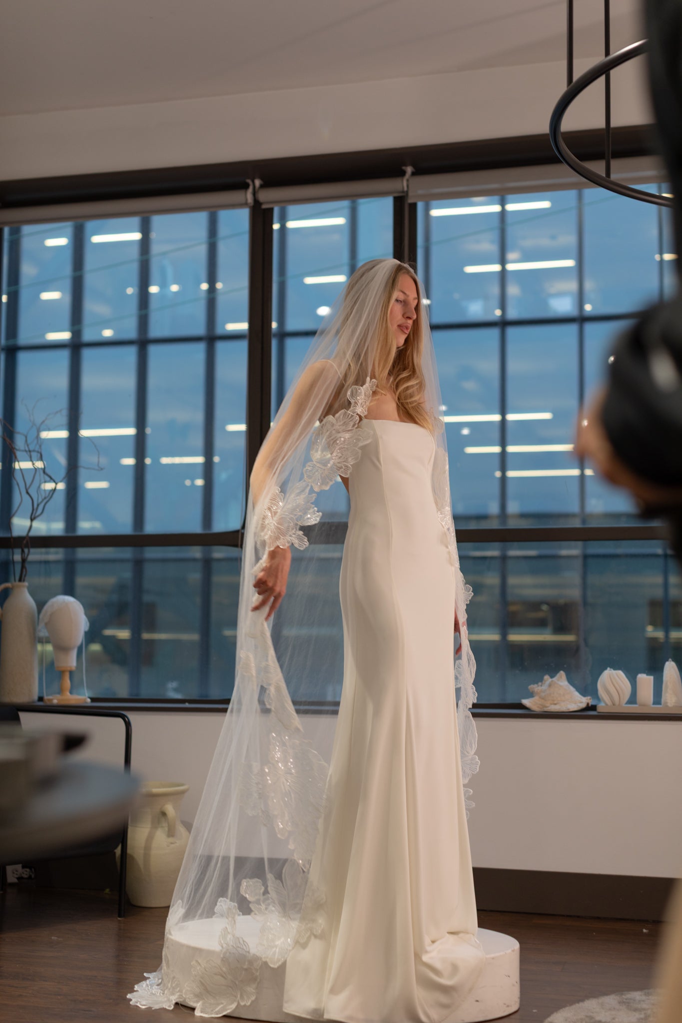 Woman Trying a Wedding Dress in Vancouver at TEMPÊTE Bridal Boutique