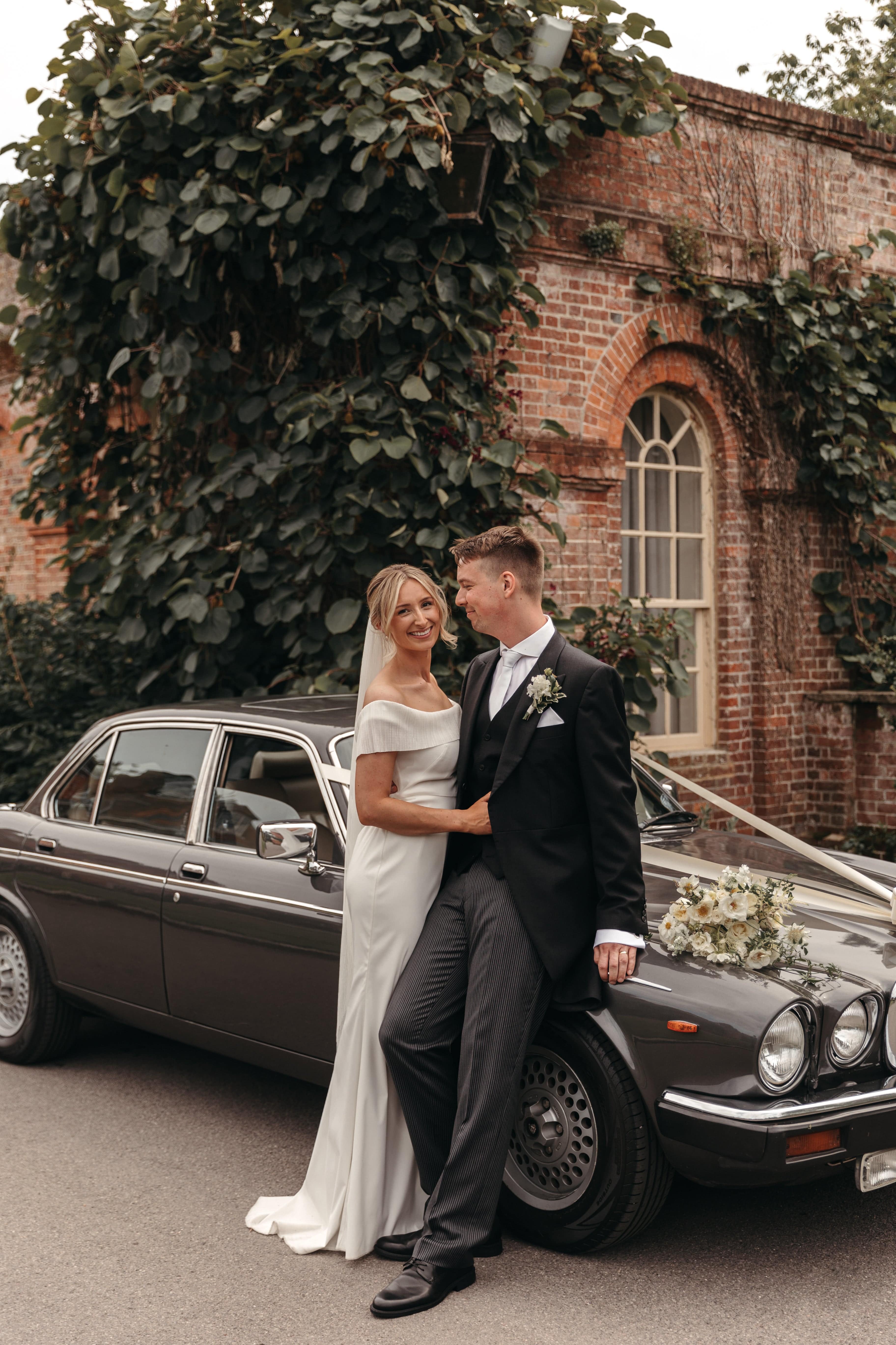 Bride is wearing best-selling Coquille Pleated Tulle Veil by TEMPÊTE, completed with a minimalist gold comb.